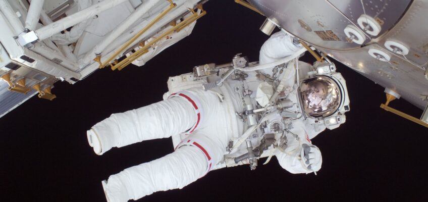 person in white astronaut suit